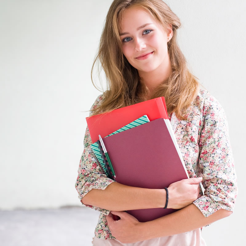 AHP Student Medical Insurance - College student with books 