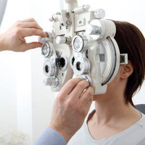 Close up image of a Woman at the eye doctor having her eye exam