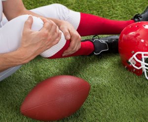 Football playing student-athlete injured on the field