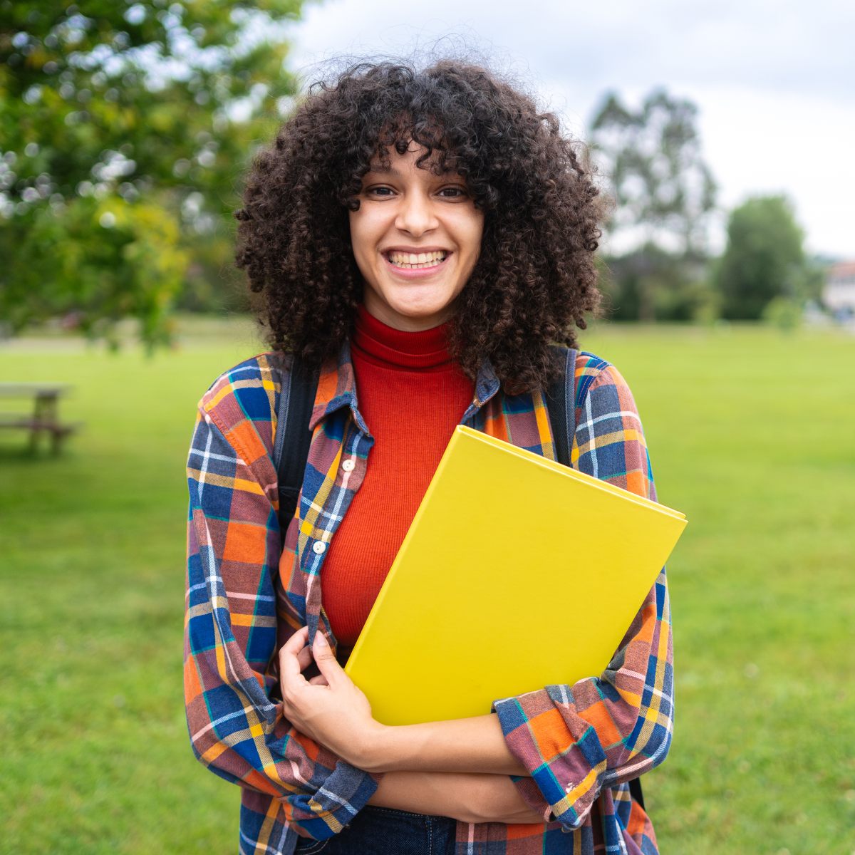 AHP Student Medical Insurance - College student with books